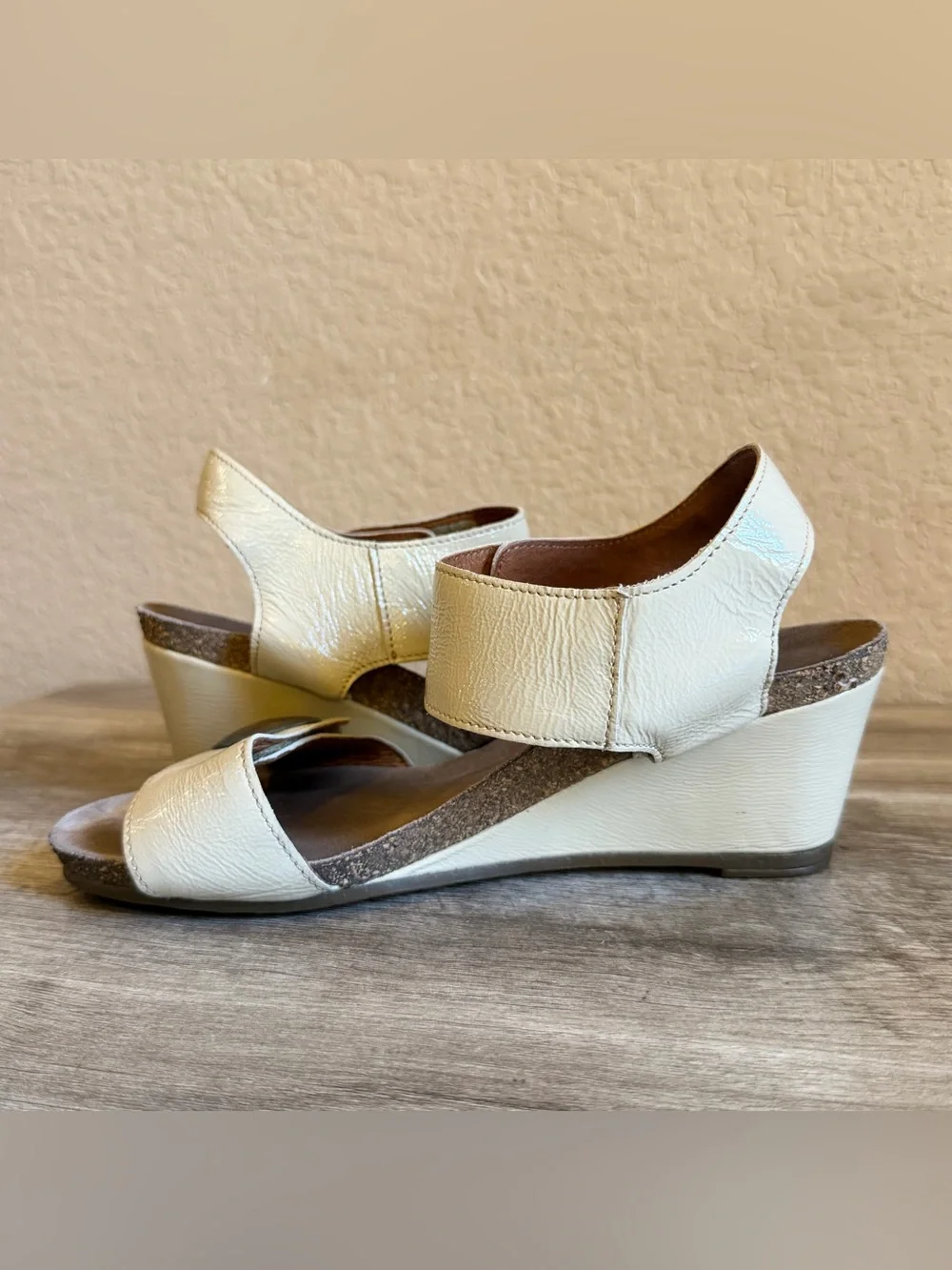 Taos Carousel wedge sandals cork-cushioned footbed metallic buttons
